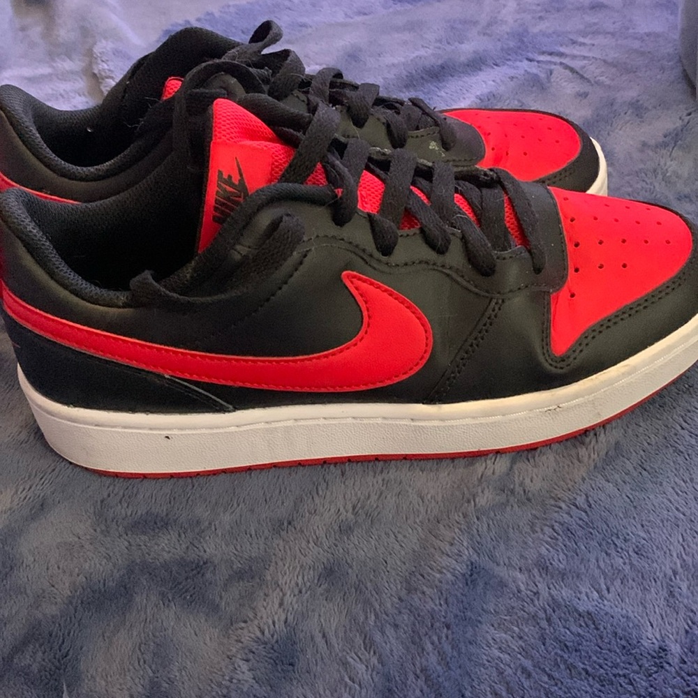 Women’s red and black Nike dunk lows